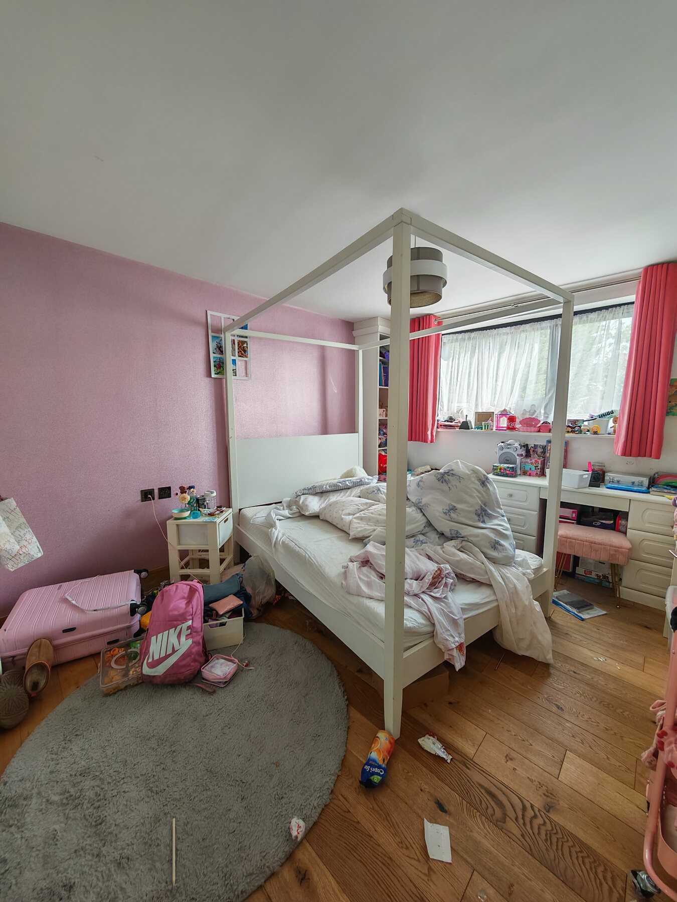 Cluttered bedroom before a TipTop deep clean and organisation
