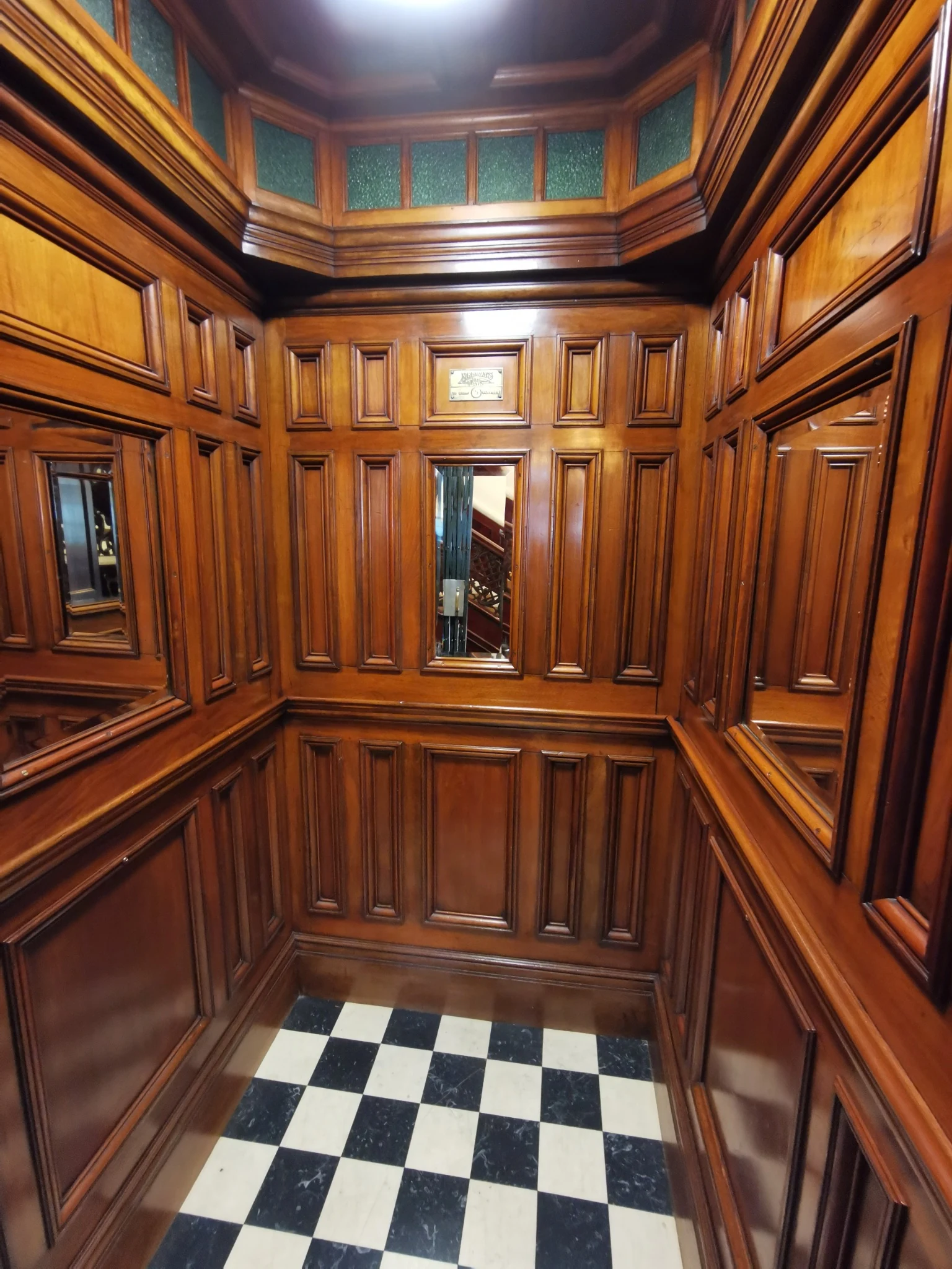 Wood-panelled communal lift