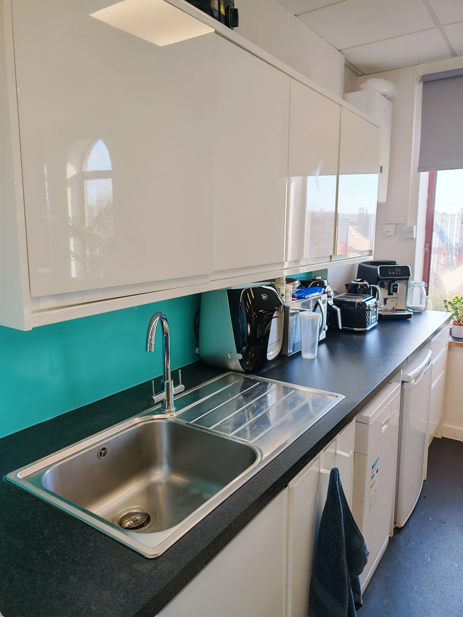 Clean white office kitchen